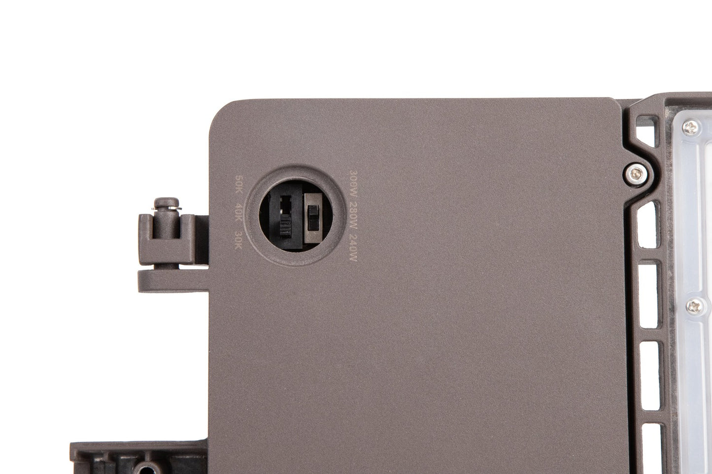 Close-up view of the bronze GridMax Series LED Area Light highlighting the wattage and CCT selectable DIP switches