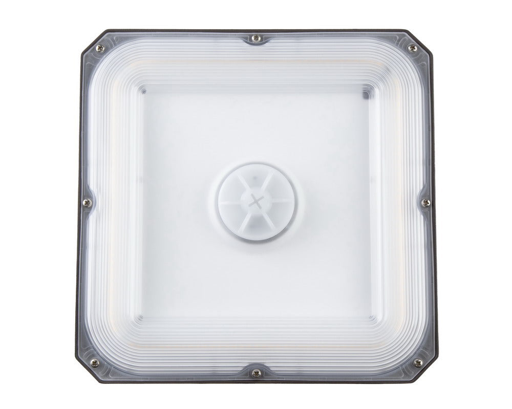 Bottom view of the NCLTG CanoLux Series LED Canopy Light showing its impact-resistant polycarbonate lens for enhanced durability and glare control