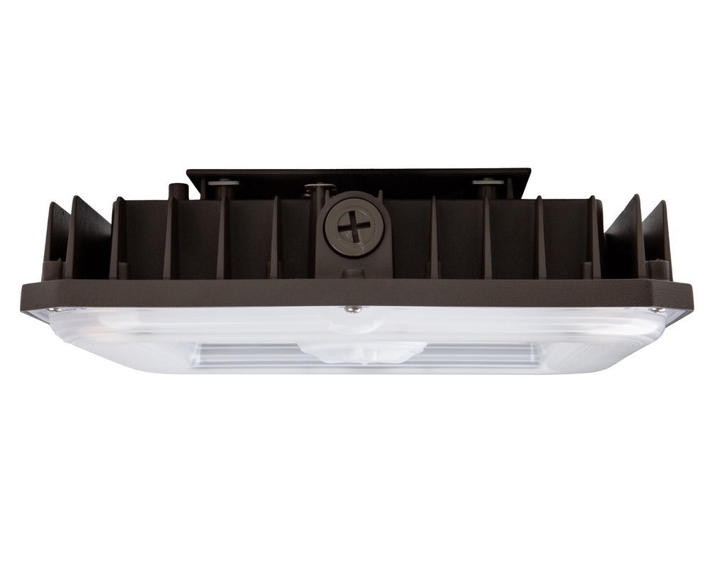 Side view of the NCLTG CanoLux Series LED Canopy Light showing the polycarbonate lens and knockout point for streamlined installation