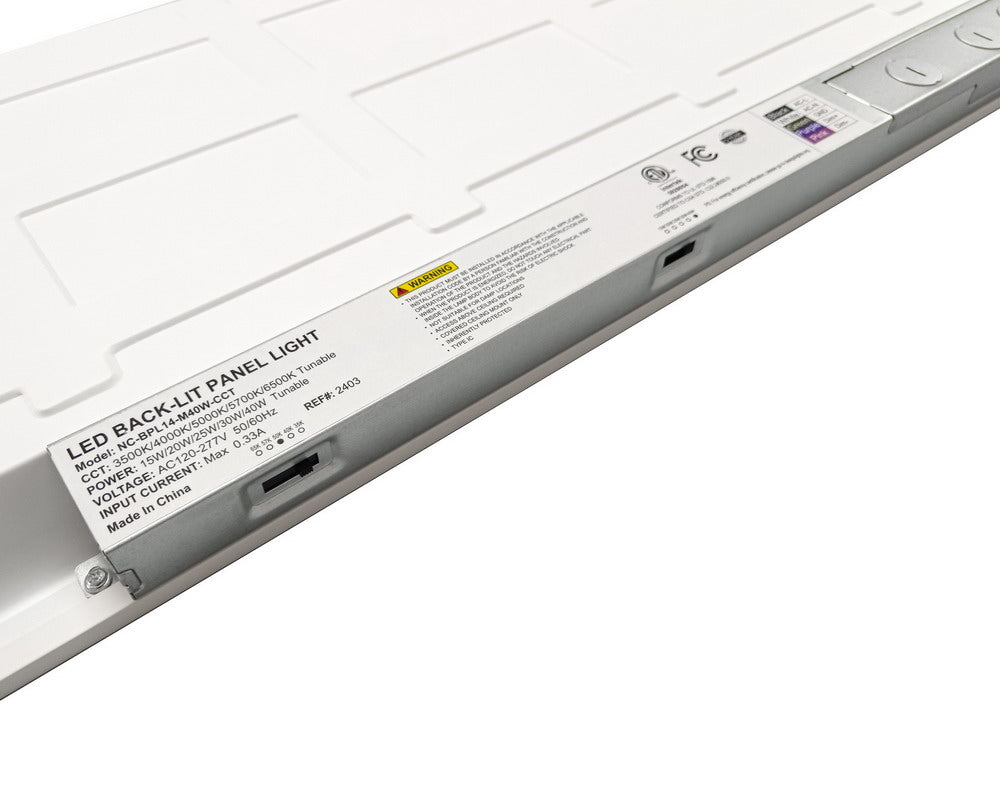 Close-up back view of NCLTG SkyLine Series 1x4 LED Panel Light focusing on the integrated driver and wiring access for selectable settings