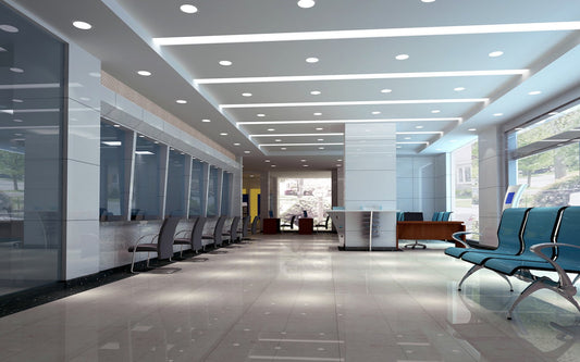 6-inch LED commercial downlights installed in the ceiling of a large modern office building, providing bright and even illumination across open workspaces.