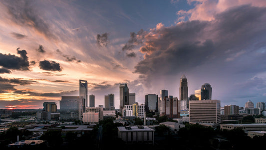 Sunset over the Charlotte, NC skyline highlighting regional growth in commercial lighting industries — Photo by Daniel Weiss on Unsplash