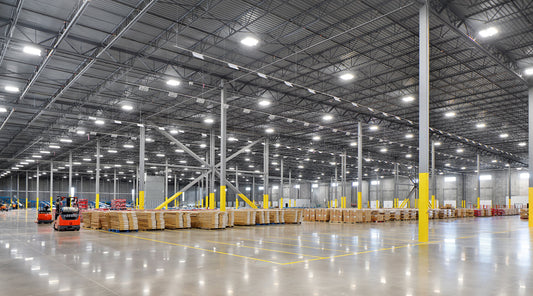 High bay LED lighting illuminating a spacious warehouse interior, showcasing energy-efficient commercial lighting solutions