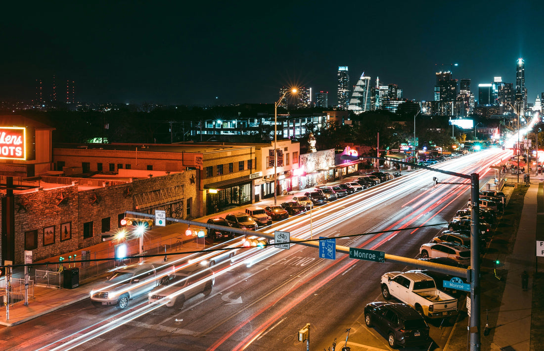 Busy city street at night in Austin, Texas highlighting the demand for commercial lighting solutions in Dallas and across Texas – Photo by Steven Pahel on Unsplash