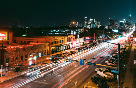 Busy city street at night in Austin, Texas highlighting the demand for commercial lighting solutions in Dallas and across Texas – Photo by Steven Pahel on Unsplash