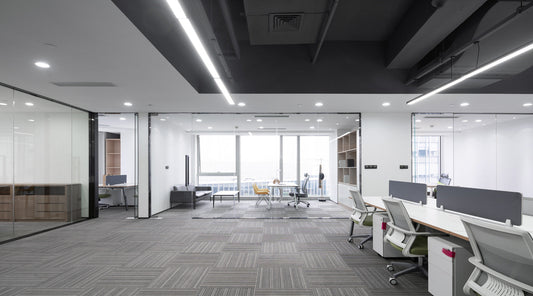 Modern LED commercial downlights illuminating a bright retail and office space