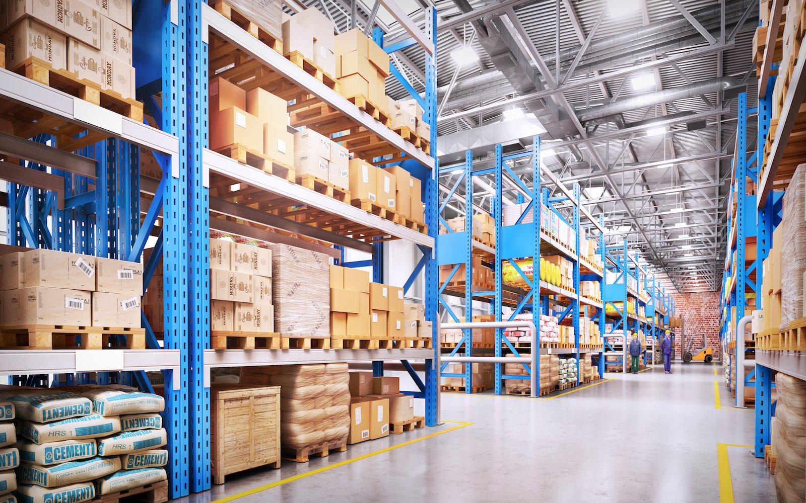 2-foot linear LED high bay lights illuminating large warehouse aisles with blue racks, showcasing efficient commercial indoor lighting solutions for industrial spaces.