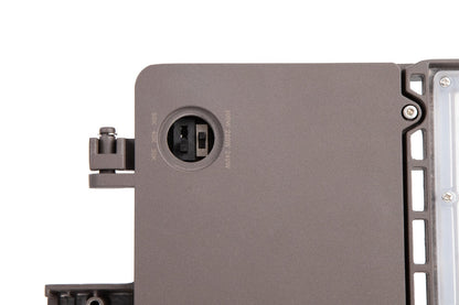 Close-up view of the bronze GridMax Series LED Area Light highlighting the wattage and CCT selectable DIP switches