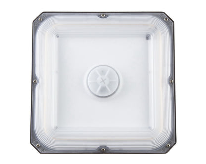 Bottom view of the NCLTG CanoLux Series LED Canopy Light showing its impact-resistant polycarbonate lens for enhanced durability and glare control