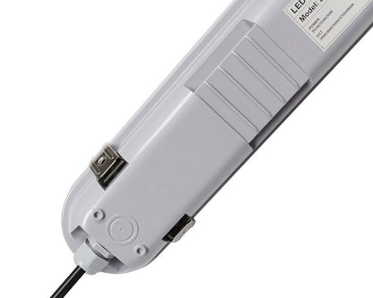 Close-up back view of the NCLTG StormGuard Series 4-Foot LED Vapor Tight Light showing the knockout and connected power cable