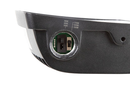 Up-close view of the NCLTG TitanBeam Series flood light highlighting the wattage and CCT selectable DIP switches