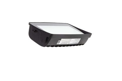Upside-down angled view of the NCLTG TitanBeam Series flood light showing the top of the fixture with certification labels, model information, and lens