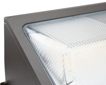 Close-up corner view of the NCLTG WallGuard Series LED Wall Pack Light highlighting the lens and construction details